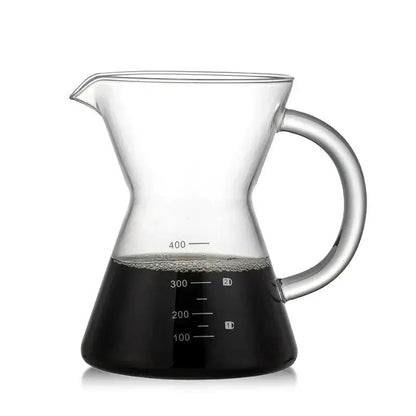 Clear glass coffee pot with stainless steel filter and curved handle featuring measurement markings for precise brewing