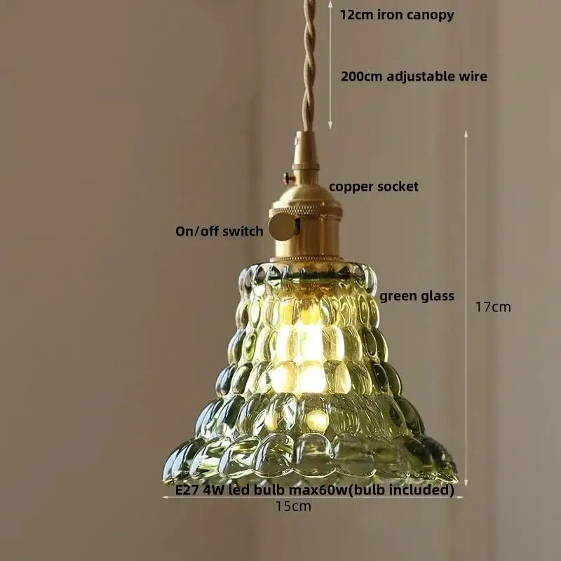 A vintage-style green glass pendant light with ornate brass socket and iron canopy for decorbites acrylic led pendant