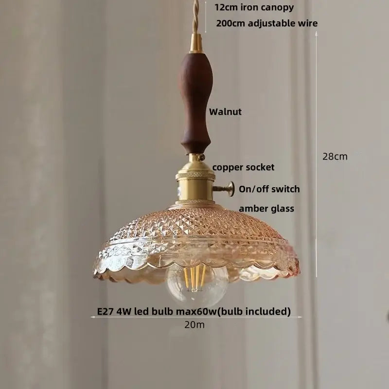 A vintage-style pendant light with dark walnut wood canopy, brass socket, and scalloped amber glass shade decorbites acrylic led