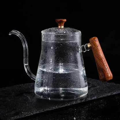 Clear glass hand drip coffee kettle with wooden handle and lid knob filled with water for decorbites glass coffee use