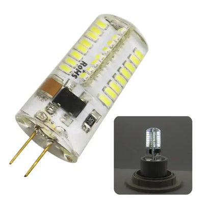Clear glass led chandelier bulb with multiple yellowish leds and gold-colored pins for dining room spotlight use