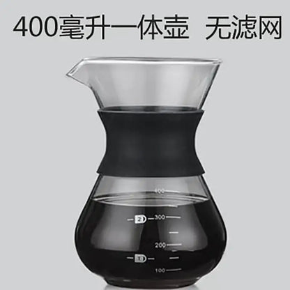 Clear glass pour over coffee maker with black silicone handle and stainless steel filter with measurement markings
