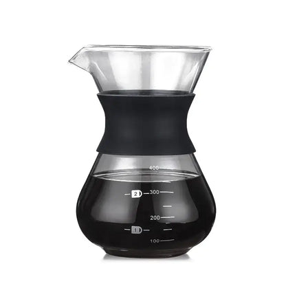 Clear glass pour over coffee maker with black silicone handle and stainless steel filter with measurement markings