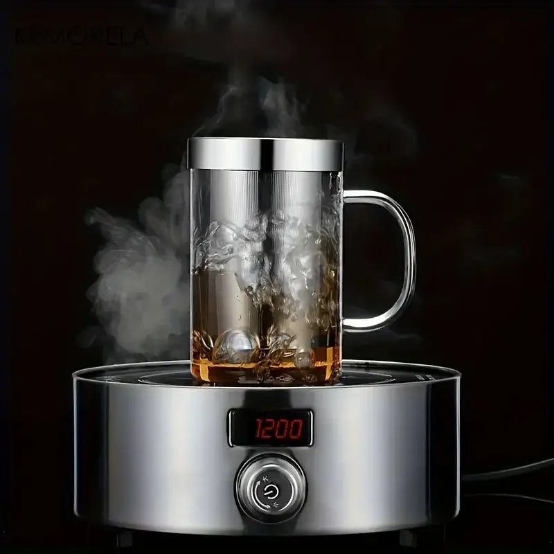 A sleek stainless steel infuser glass tea infuser mug with transparent borosilicate body and silver lid on heating base