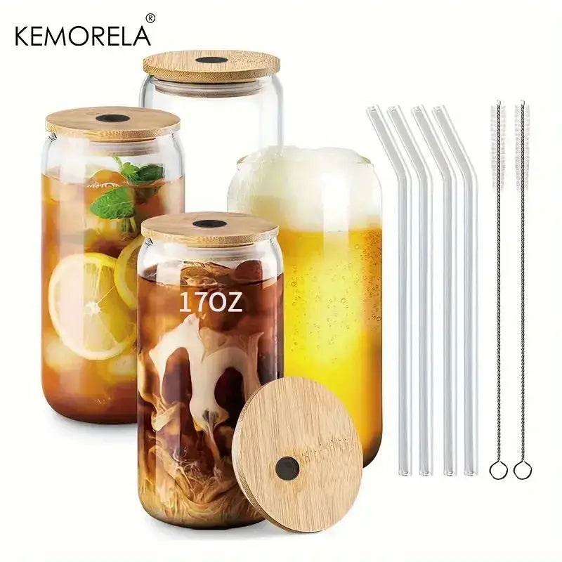 Clear glass tumbler cups with bamboo lids and transparent straws featuring 17oz capacity markings for reusable drinking