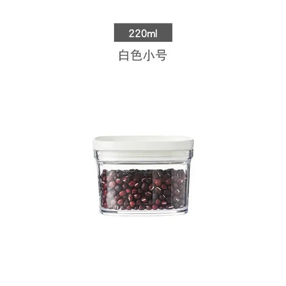 Clear glass container with white lid holding dark red beans for decorbites hermetic kitchen organizer use