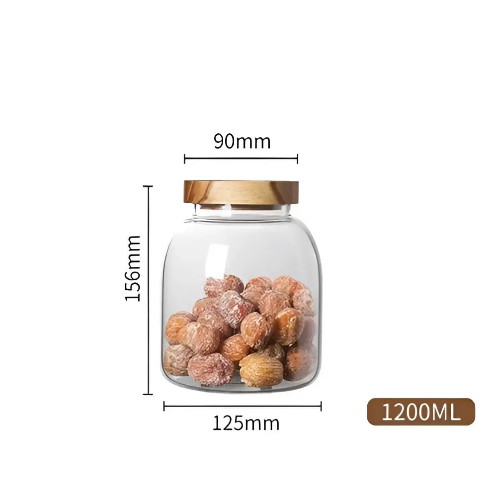 Clear kitchen glass jar with acacia lid filled with dried fruit for food storage in kitchen glass jars set of 2