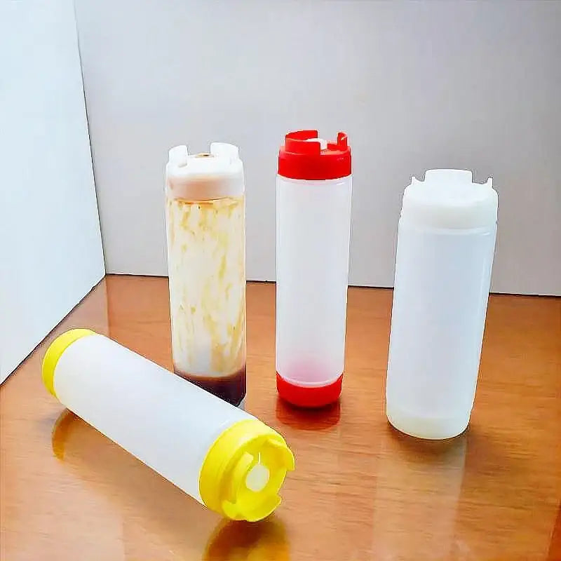 Clear plastic tomato squeeze bottles with red white and yellow caps ideal for kitchen use in a squeeze bottle set