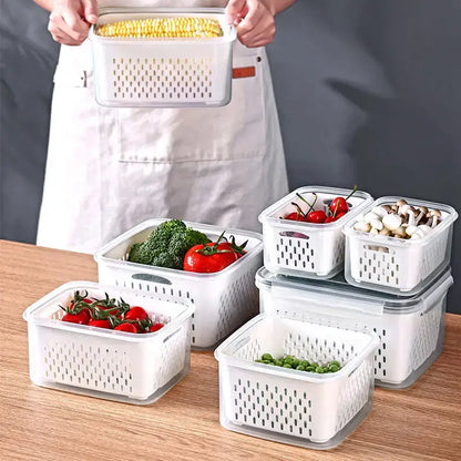 White plastic fridge storage containers with drain basket and perforated sides featuring clear lids by decorbites