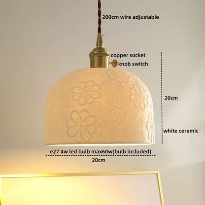 A warm cream-colored ceramic led pendant light with cloud pattern and brass-finished copper socket for dining room decorbites ceramic led