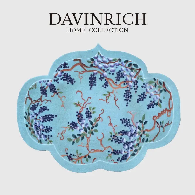 A light blue cloud shaped door mat featuring purple wisteria grape vine chinoiserie from davinrich home collection