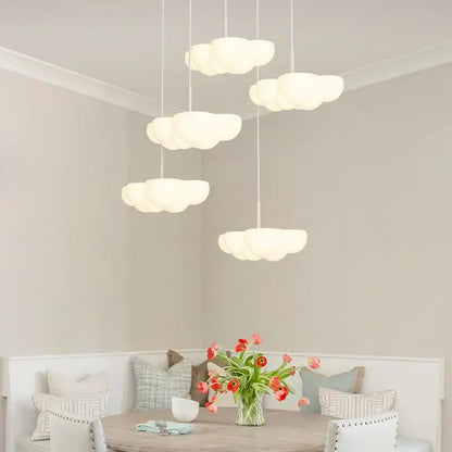 Cloud white modern white chandelier with cloud-shaped pendant lights hanging above floating kitchen island decorbites cloud white