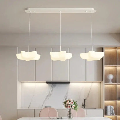 Three white cloud-shaped pendant lights hang from a sleek fixture in the decorbites cloud white modern chandelier design