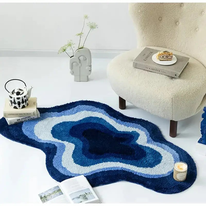 A plush layered blue and white gradient cloudy blues wavy retro bath mat with an organic shape for bathroom decor
