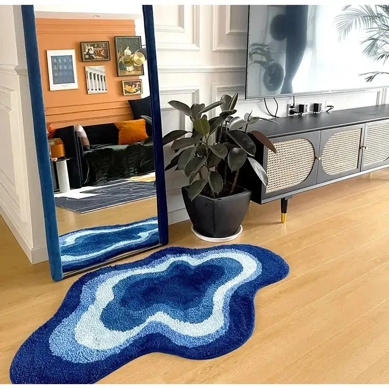 A plush blue and white gradient cloudy blues wavy retro bath mat with an organic shape for bathroom decorbites decor