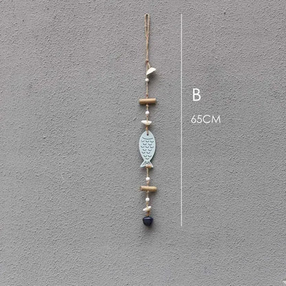 Coastal blue and white fish drift wood bells made of painted metal with bamboo beads and twine loop wall decor