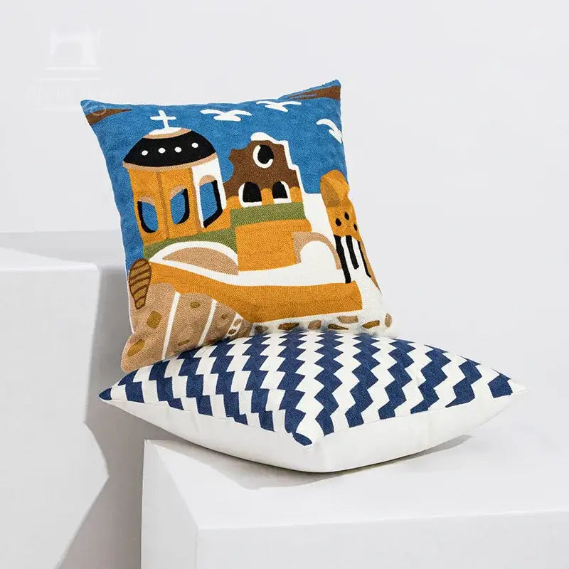 Blue and beige embroidered cushion cover featuring coastal chic greek architecture and white birds for living room decorbites coastal chic