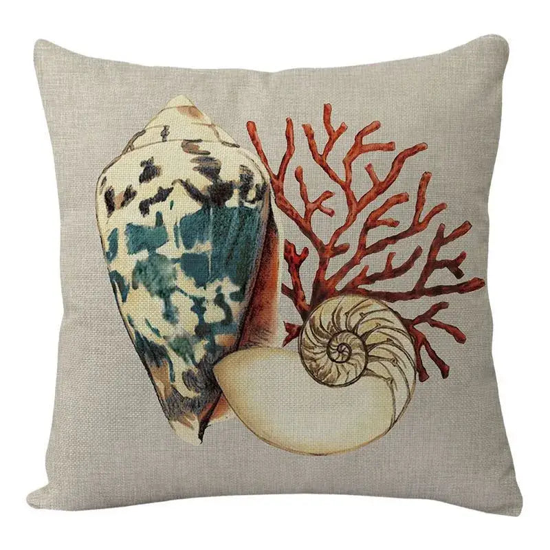 Beige linen coastal cushion cover featuring a printed speckled conch shell coral and spiral nautilus decorbites coastal set