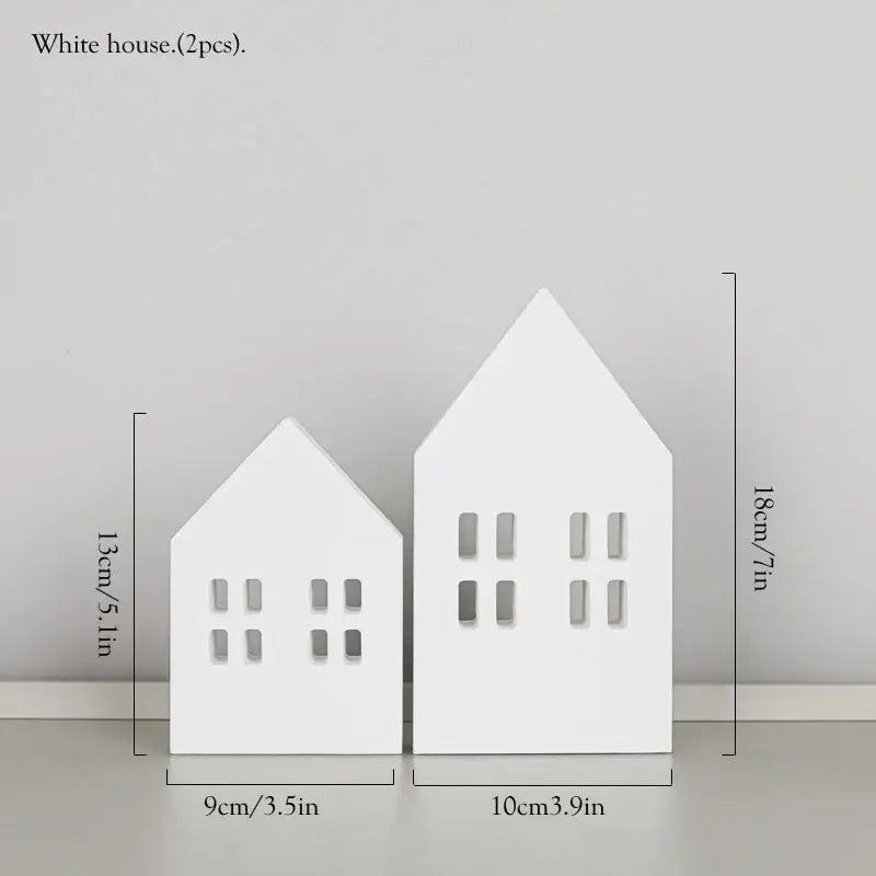 White ceramic house decor with cut-out windows paired with decorbites coastal wooden ship model for living room display
