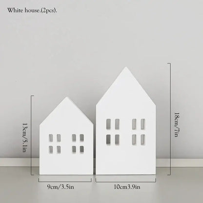 White ceramic house decor with cut-out windows paired with decorbites coastal wooden ship model for living room display