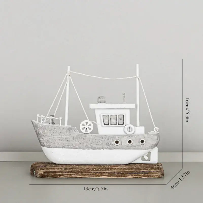 White and gray distressed metal ship model on rustic wooden base for decorbites coastal wooden living room decor