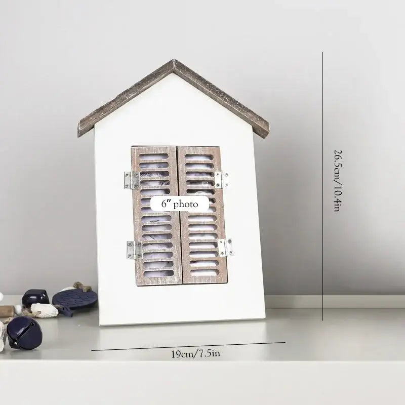 White wooden house-shaped photo frame with rustic brown shutters and silver hardware for decorbites coastal wooden ship model decor