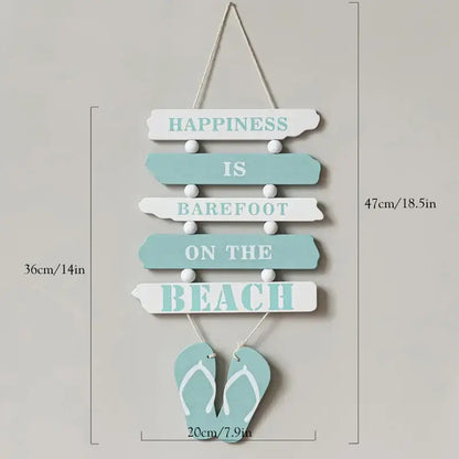 Coastal white and gray wooden ship model decor with a light blue wooden wall hanging featuring teal beach lettering and flip-flops