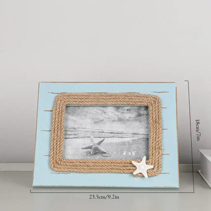 Light blue wooden picture frame with natural rope border and white starfish accent for decorbites coastal wooden ship model