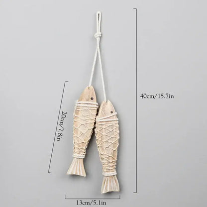 Two beige handcrafted wooden fish ornaments with woven rope detailing for decorbites coastal wooden ship model decor