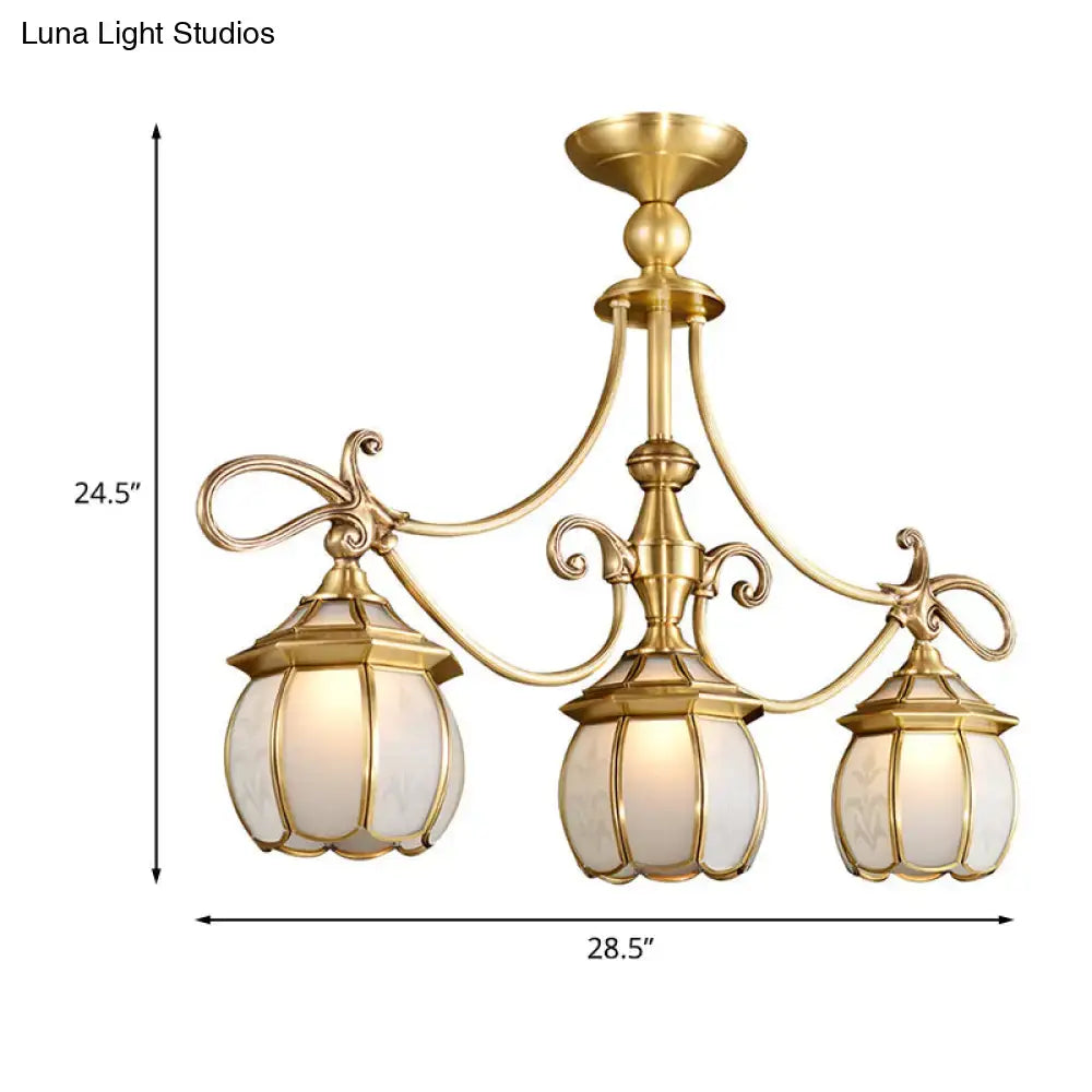 Gold-finished brass decorbites colonial lantern island light fixture with three frosted ivory glass shades for dining room