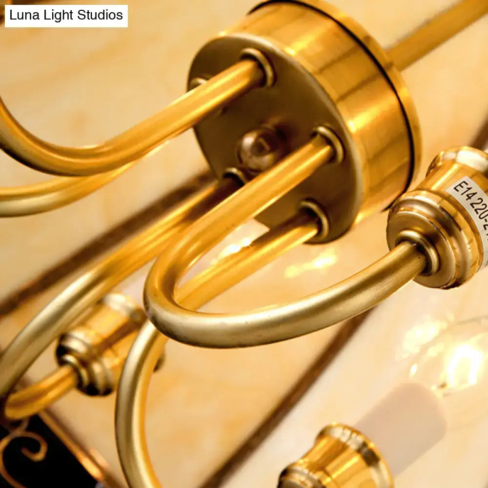 Brass-finished chandelier arm with curved polished rods and central plate for colonial style pendant light with glass shade