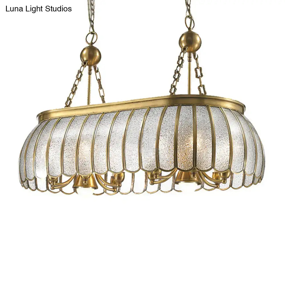 Antique brass colonial style pendant ceiling light with bubble glass panels and scalloped edges for kitchen decor