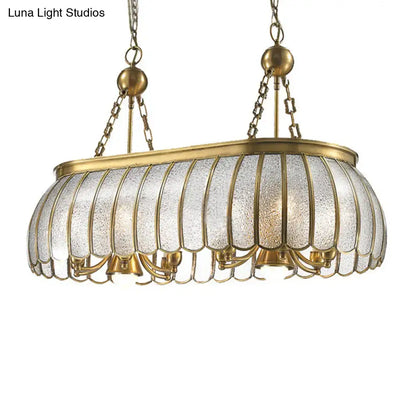 Antique brass colonial style pendant ceiling light with bubble glass panels and scalloped edges for kitchen decor