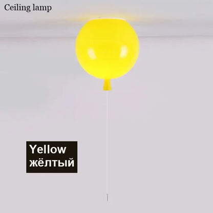 A bright yellow decorbites colorful balloon ceiling light with a glossy finish and thin white cord for bedroom and nursery decor