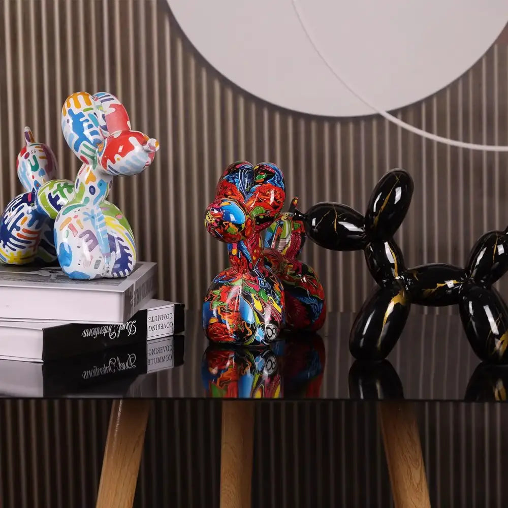 Glossy colorful balloon dog statue with bold multicolored patterns and sleek black finish for living room decorbites decor