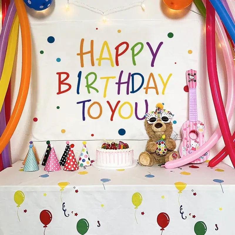 A colorful cartoon animal birthday wall tapestry featuring a plush brown teddy bear with party accessories decorbites birthday wall decor