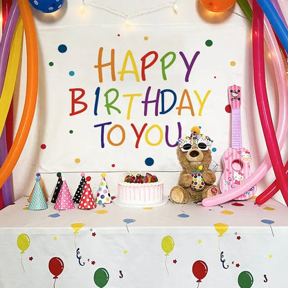 A colorful cartoon animal birthday wall tapestry featuring a plush brown teddy bear with party accessories decorbites birthday wall decor