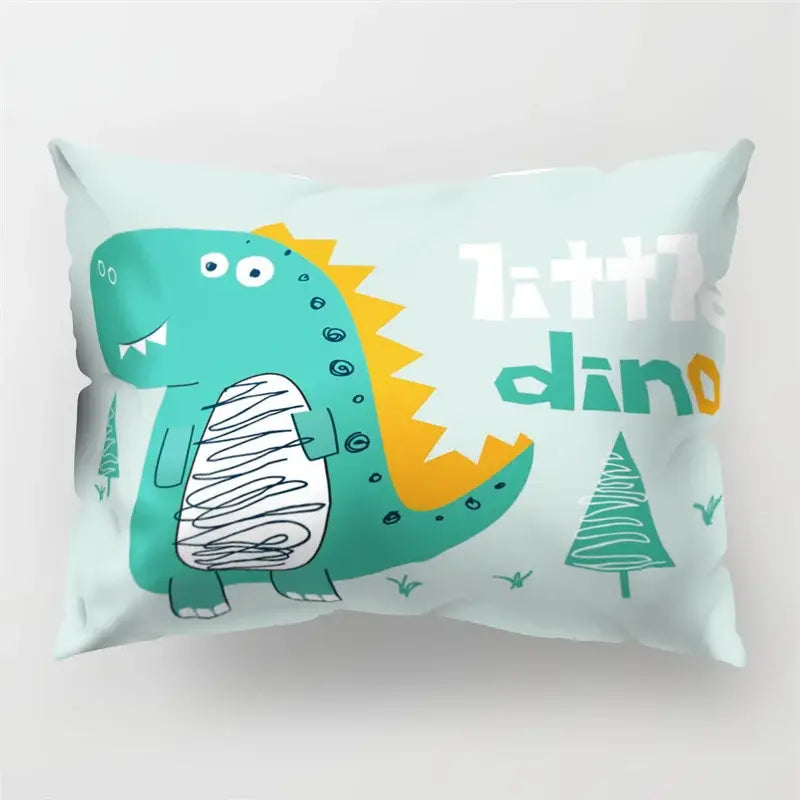 A mint green colorful cartoon dinosaur pillowcase with teal and yellow accents for kids bedroom decor by decorbites