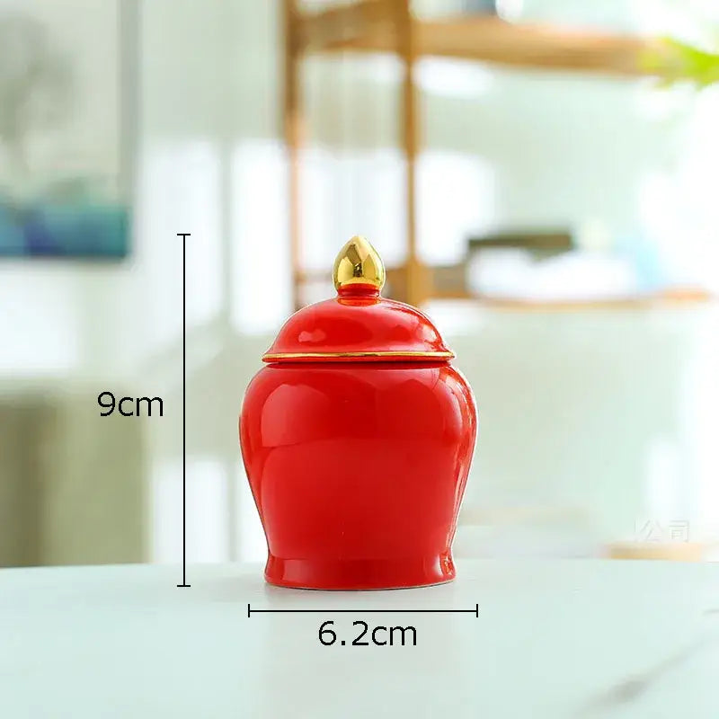 Glossy red ceramic storage jar with gold-tipped lid and trim, 9cm height, ideal for kitchen tea caddy use