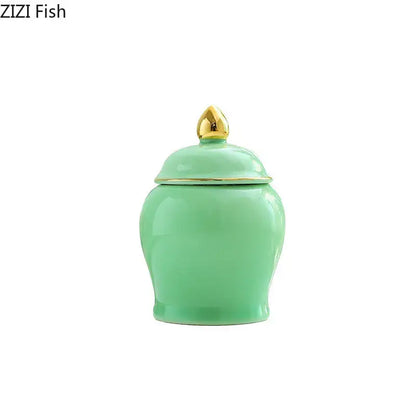 Mint green ceramic storage jar with gold-toned lid and decorative finial ideal for kitchen tea caddy use