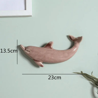 Smooth matte-finished pink ceramic dolphin fish ocean wall decoration for children’s room by decorbites dolphin fish
