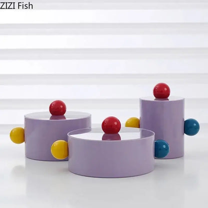 Lavender cylindrical storage jar with colorful dot decorative red yellow and blue glossy spherical accents for bedroom organizer