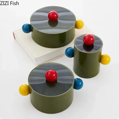 Olive green colorful dot decorative storage jars with glossy black lids and red spheres for bedroom organization