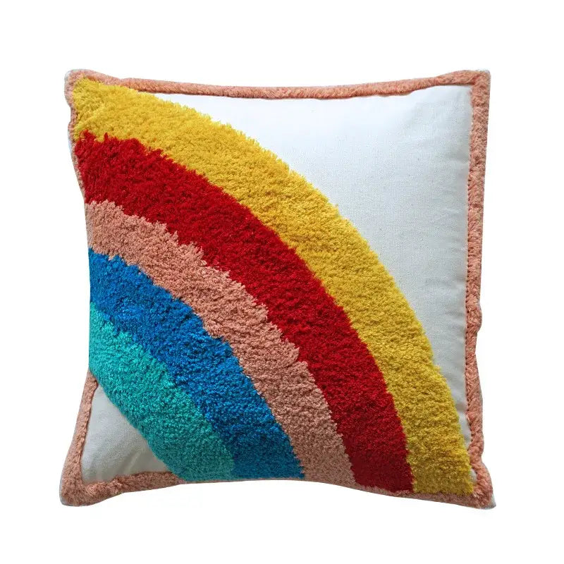 Colorful decorbites geometric tassel pillowcase featuring hand-embroidered rainbow yarns with peach fringe border