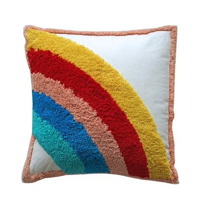 Colorful decorbites geometric tassel pillowcase featuring hand-embroidered rainbow yarns with peach fringe border
