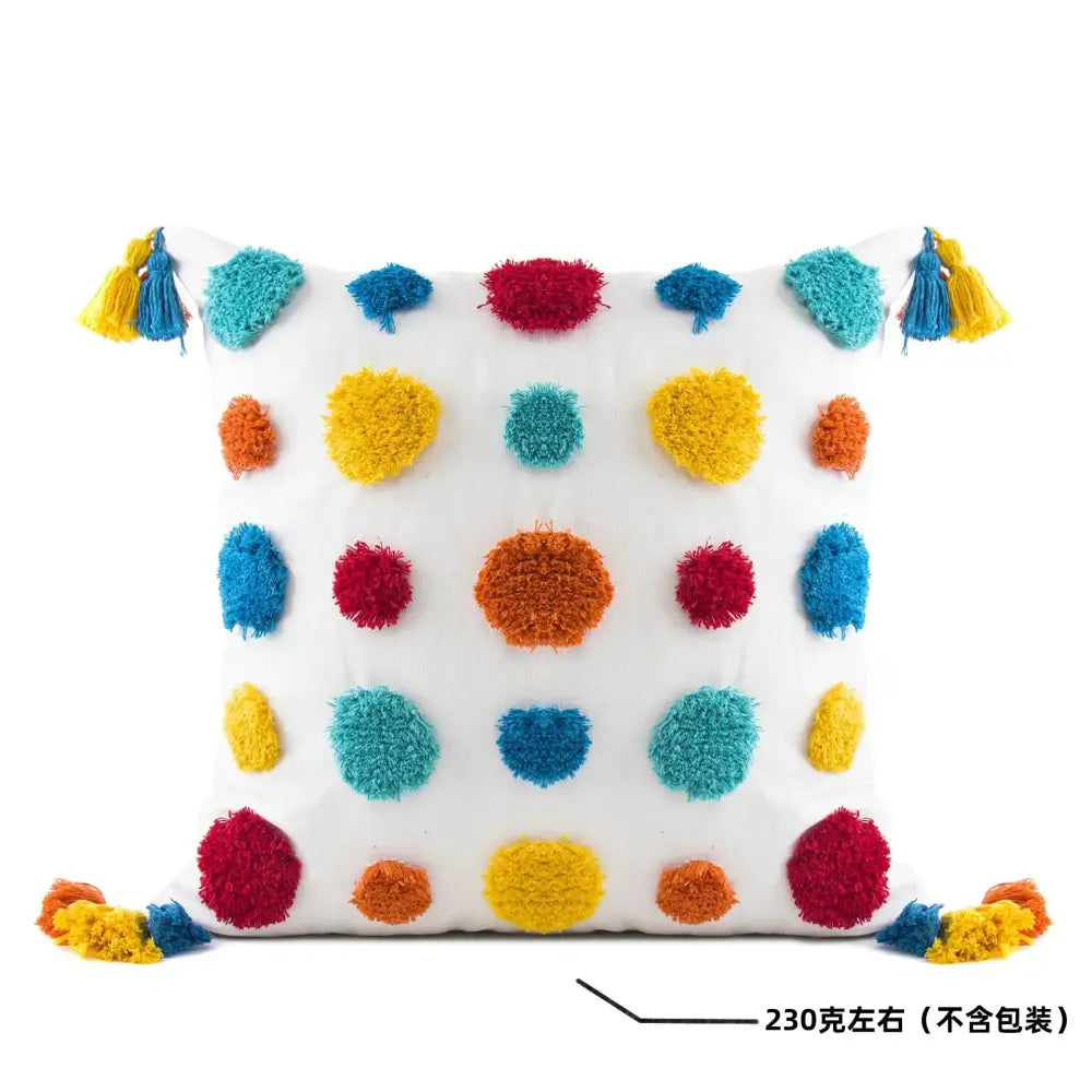 White cushion with colorful fluffy pom-poms and tassels in red yellow blue and orange decorbites geometric tassel pillowcase
