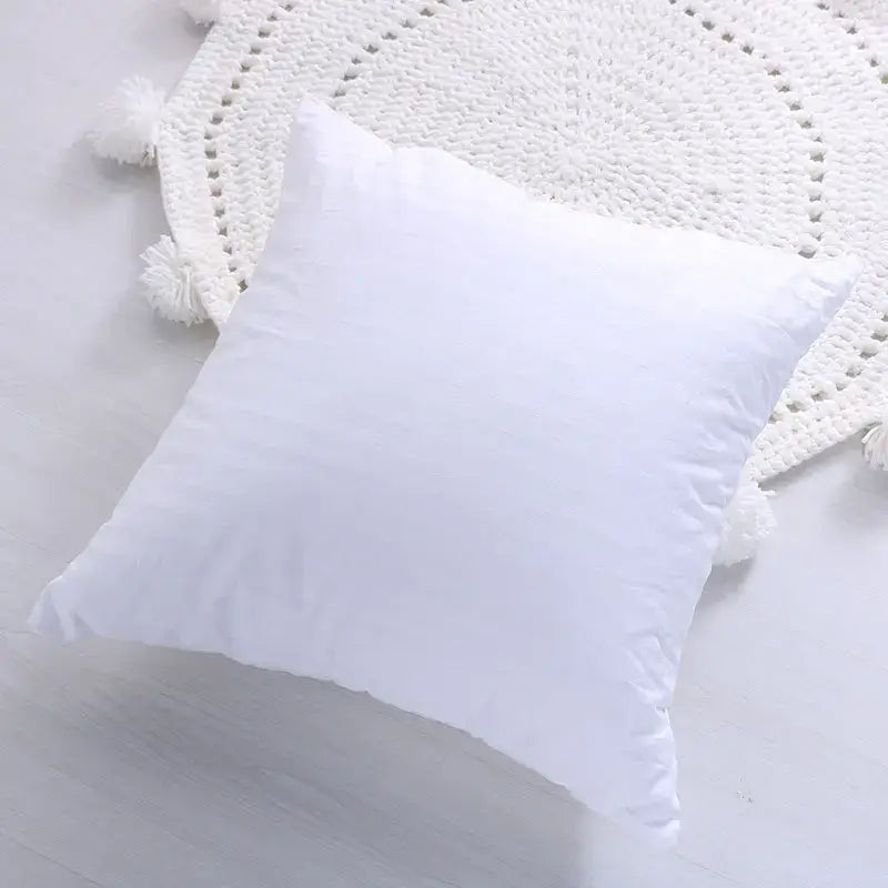 White square cushion with soft plush fabric and subtle stitching details for decorbites geometric tassel pillowcase decorbites geometric hand-embroidered design