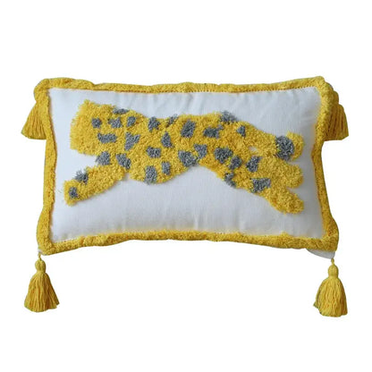 A white rectangular tassel pillowcase with a yellow gray leopard appliqué and fringed edges by decorbites geometric hand-embroidered decor