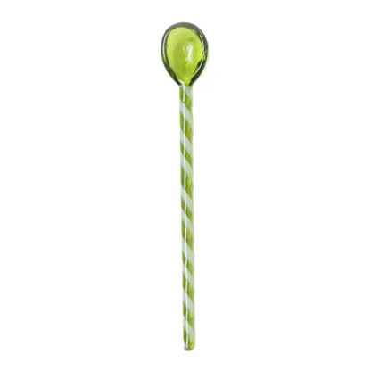 A colorful glass stirring spoon with a translucent lime green bowl and white light green striped handle from decorbites colorful glass set