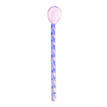 A translucent pink colorful glass stirring spoon with a blue and white twisted pattern for decorbites colorful glass set
